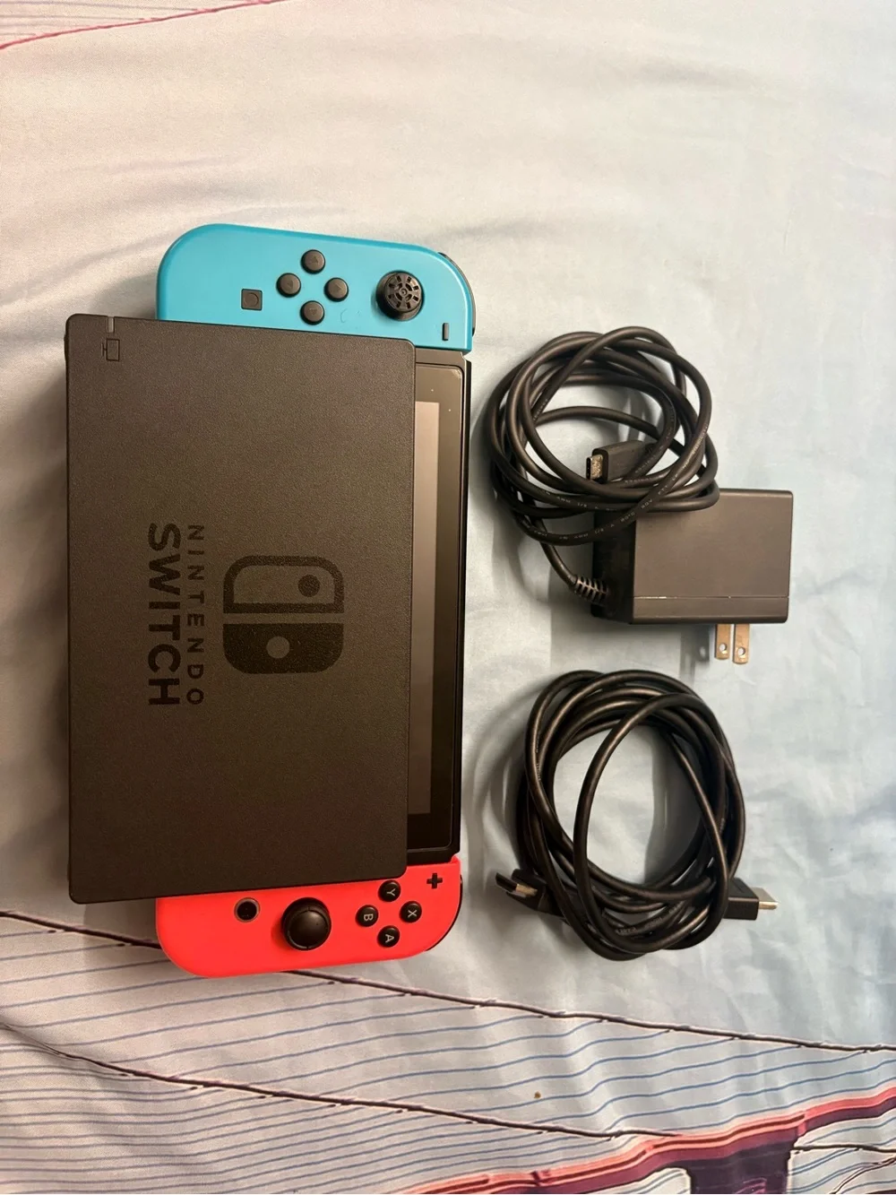 Nintendo Switch with Neon Red Right Joy‑Con and Neon Blue Left Joy‑Con
